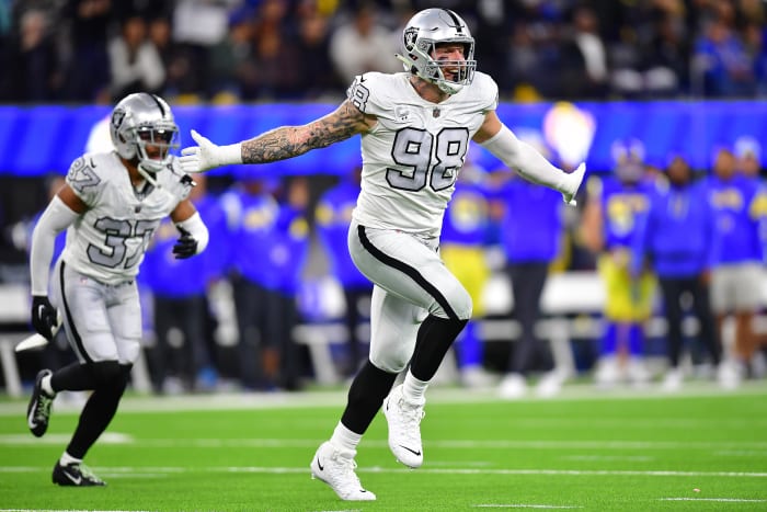 Las Vegas Raiders defensive end Maxx Crosby puts his arms out wide as he runs